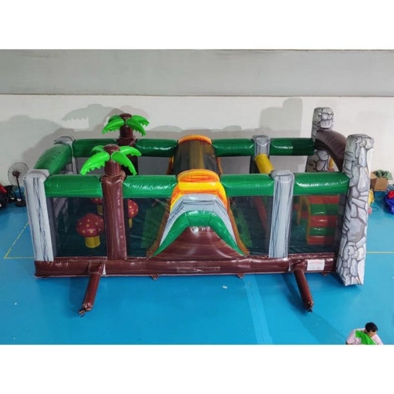 Eagle Bounce 53'L Jurassic Obstacle Course and Slide Jungle Theme Side View in Warehouse