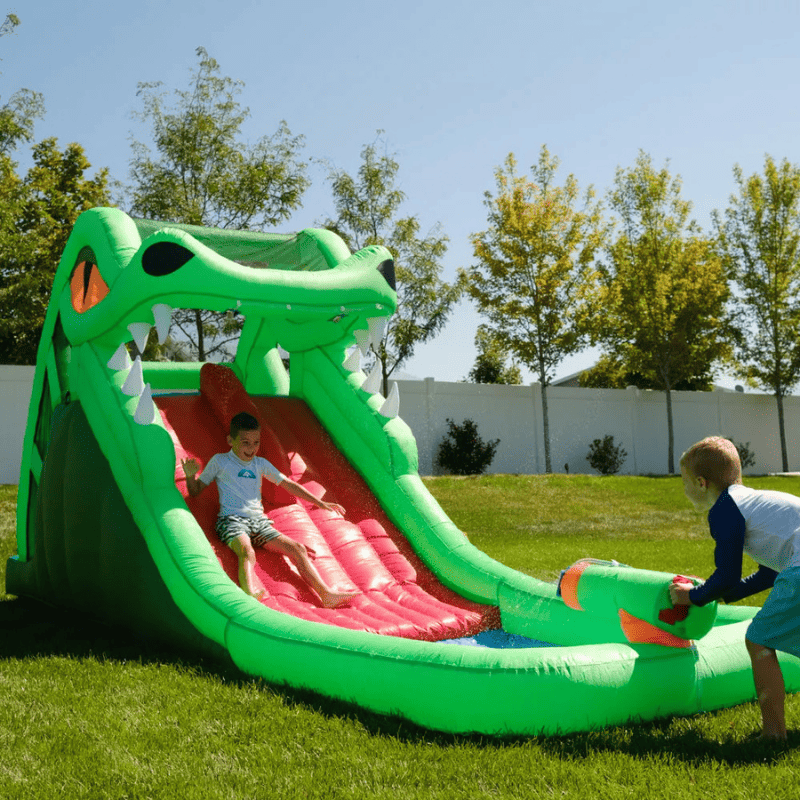 Avyna Dragon's Lair Waterslide Inflatable Front Right View Outside with Kids Playing