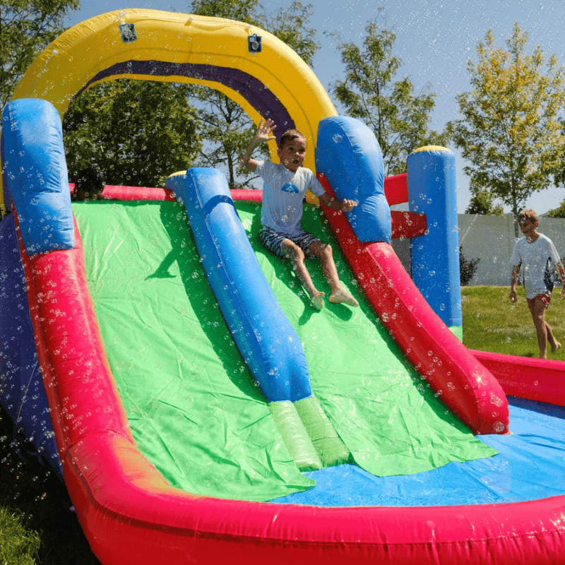Avyna Royal Wave Bounce House 1 with Inflatable Water Slide Slide Close Up View with Kid Sliding