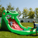 Avyna Dragon's Lair Waterslide Inflatable Front Right View Outside with Kids Playing