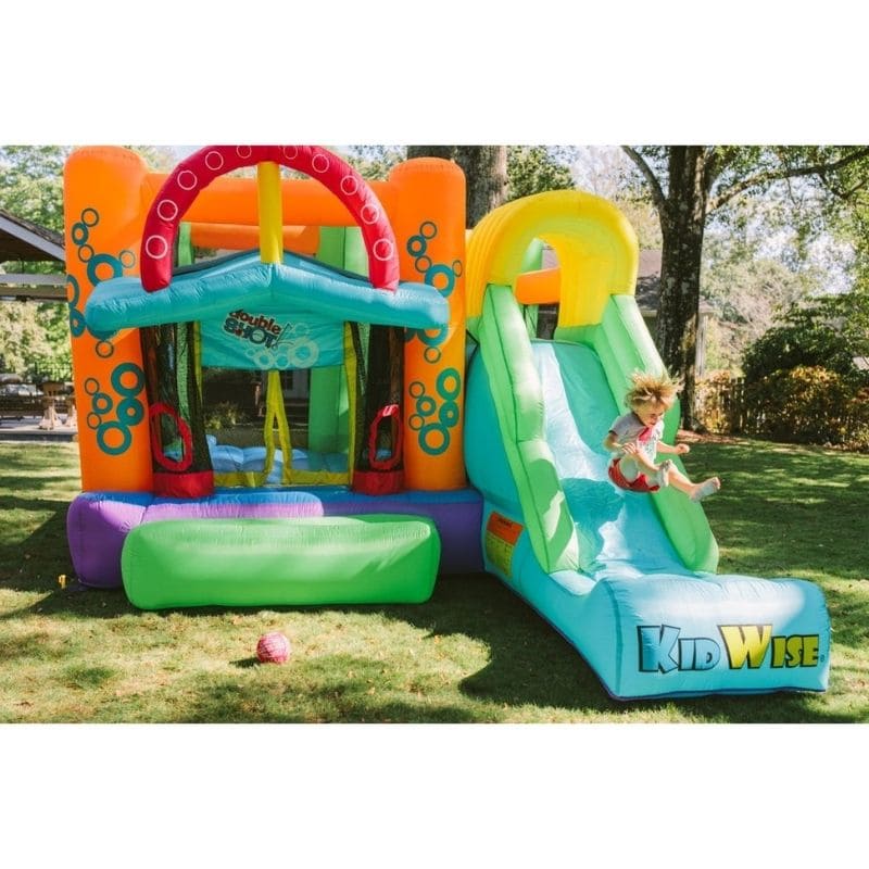 KidWise Double Shot Residential Bouncer Front Backyard View with Kid Sliding