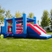Avyna Royal Palace 2 Bounce House with Obstacle Course Front Right View in Backyard
