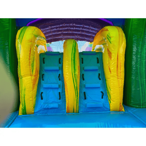 Green castle bounce house dual slides wet dry combo showing commercial vinyl construction and reinforced seams on ladder