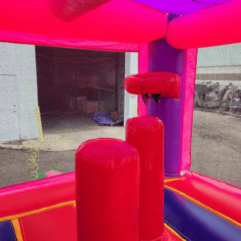2-lane pink castle combo bounce house interior basketball hoop pop-ups bounce area