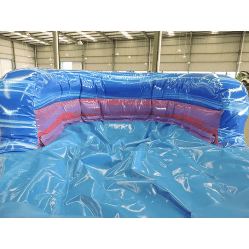 Purple bounce house dual slides wet dry combo showing commercial vinyl construction and reinforced seams
