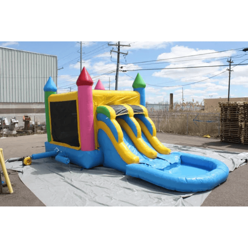 Moonwalk USA 2-Lane Rainbow Castle Combo Bounce House Outside Inflated View with Tarp Under Unit and Blower Attached