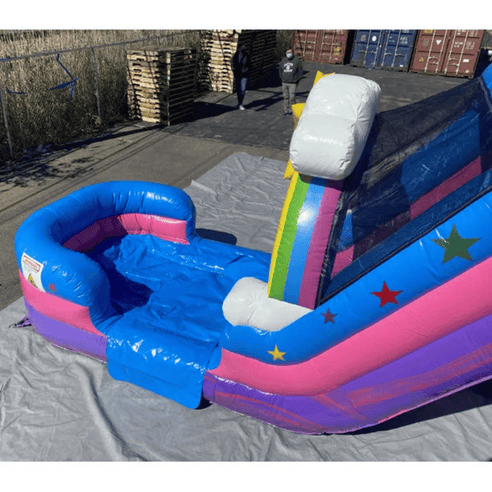 Unicorn bounce house dual slides wet dry combo showing commercial vinyl construction and reinforced seams