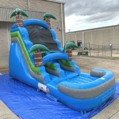 Front Right View of Eagle Bounce Blue Water Slide with Palm Trees with Green Accents
